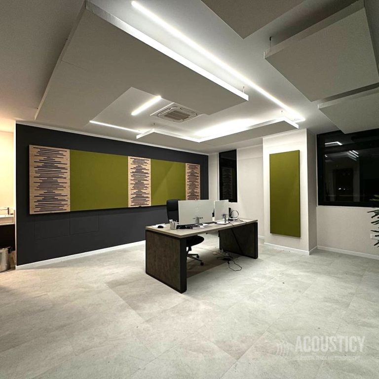 Green and textured acoustic wall panels in a private office