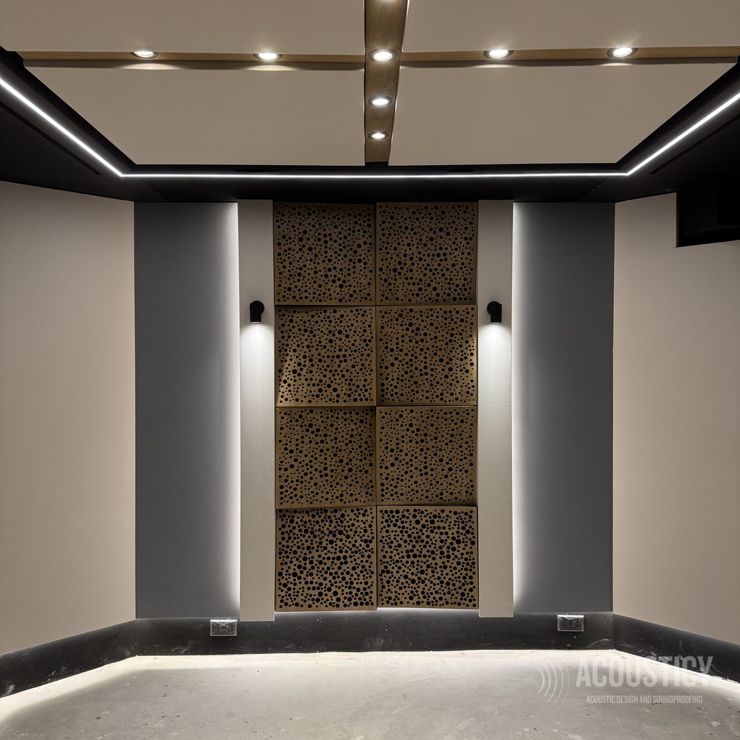 Perforated wood acoustic panel feature wall in a home cinema